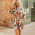 Orange floral print striped lace V-neck long sleeve mini dress on hanger