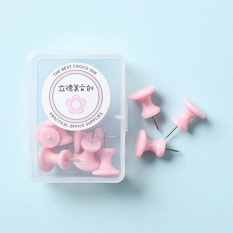 Plastic push pins in cherry blossom pink, mint green, and lavender, showing large and small sizes in a box.