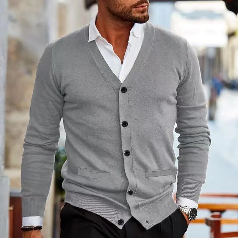 Men's slim fit acrylic cardigan sweater in autumn colours on a hanger