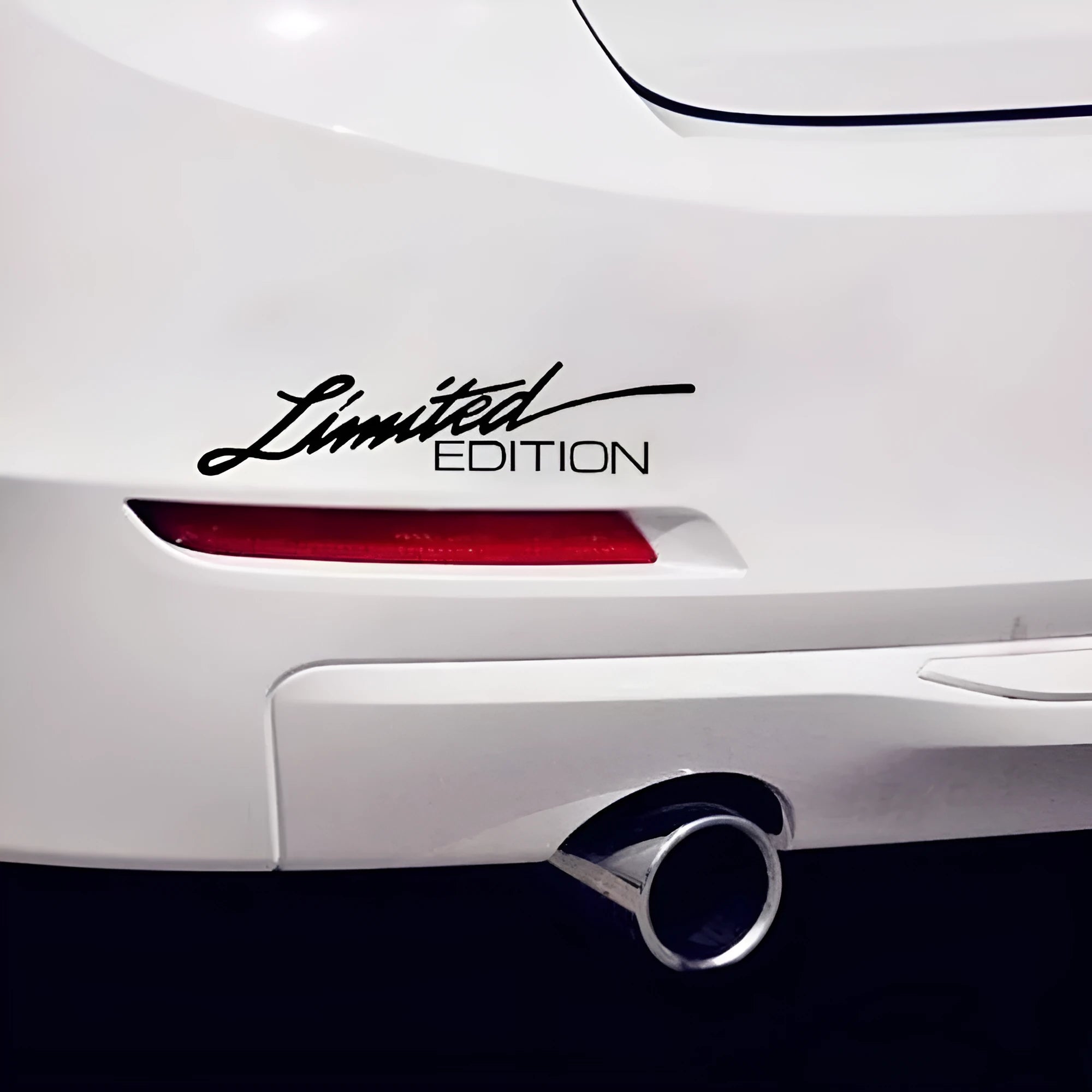 Reflective British-style bumper sticker measuring 16cm long, shown in black, white, and colourful variants.