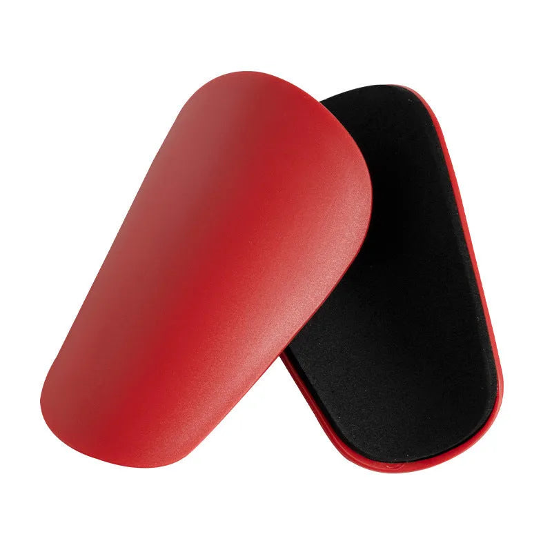 PU mini shin guards for football and sports, shown in black, white, red, and blue colours.