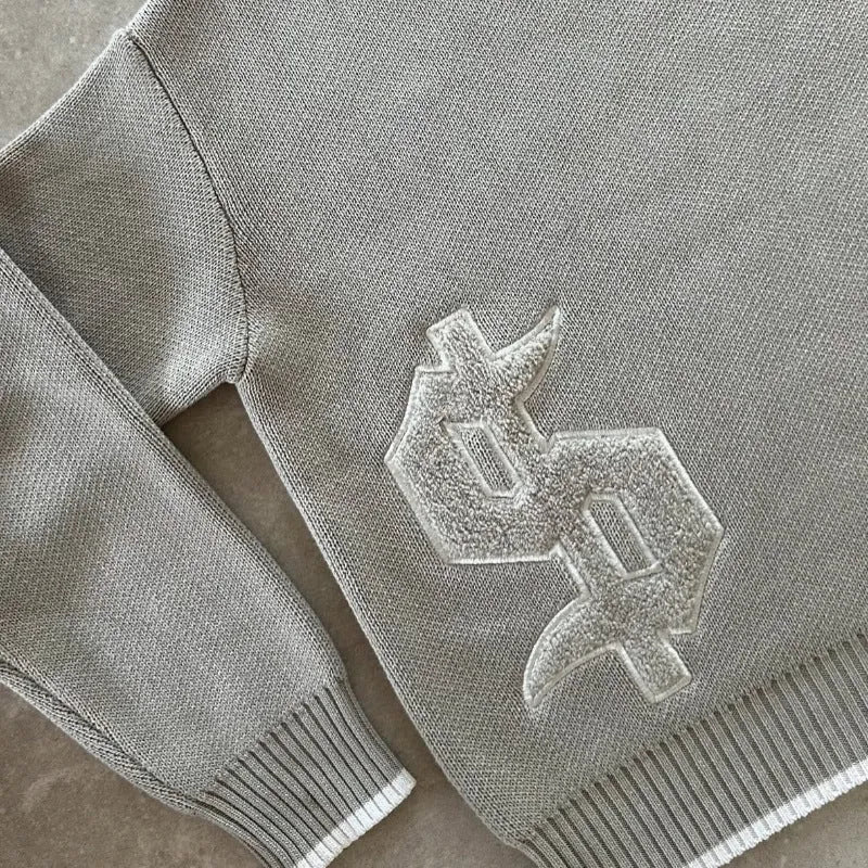 Grey jacquard knitwear coat loose-fitting pullover style with textured weave pattern
