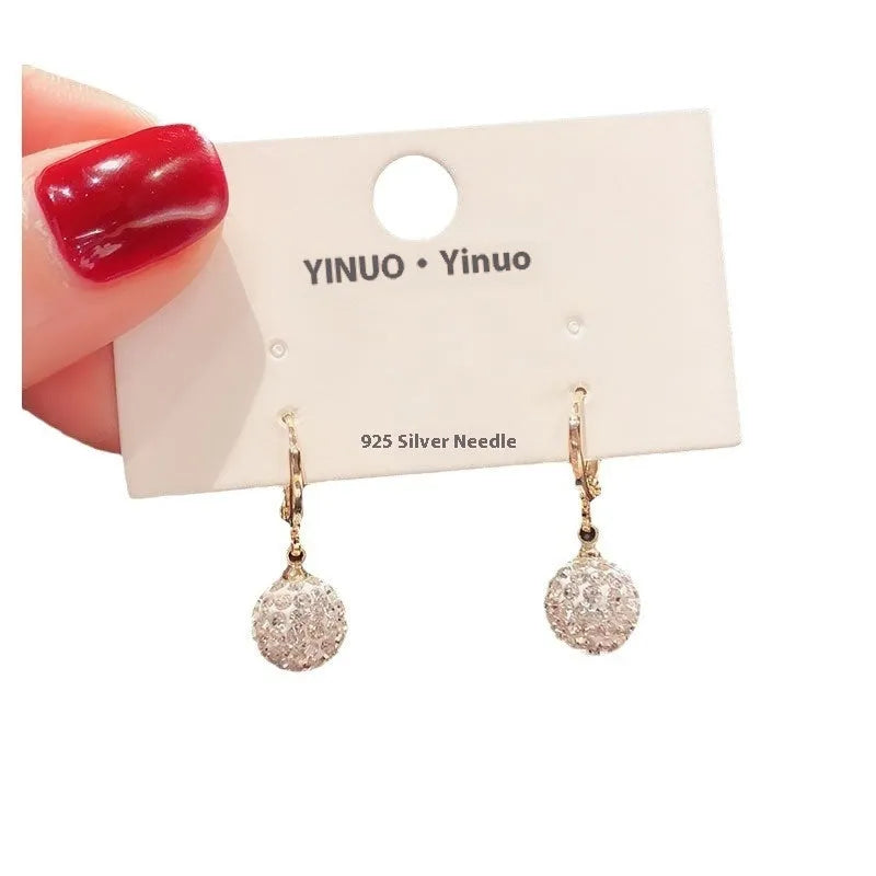 Women's geometric copper earrings with zircon and rose design elements in various colours