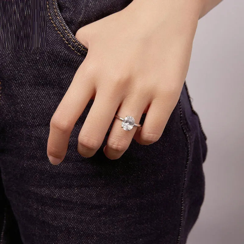 Silver oval cut zircon engagement ring with gold colour electroplating finish on white background