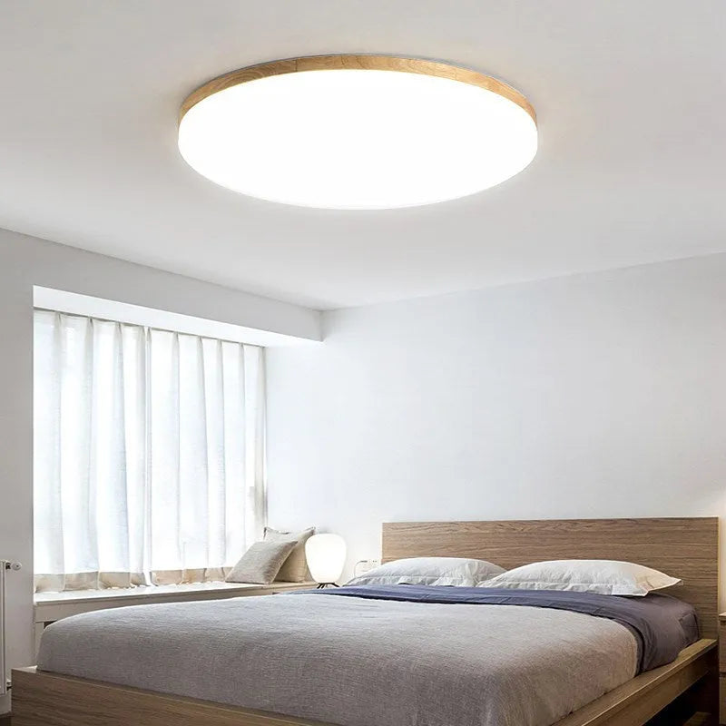 Japanese minimalist wood and acrylic LED ceiling lamp with three colour light settings.