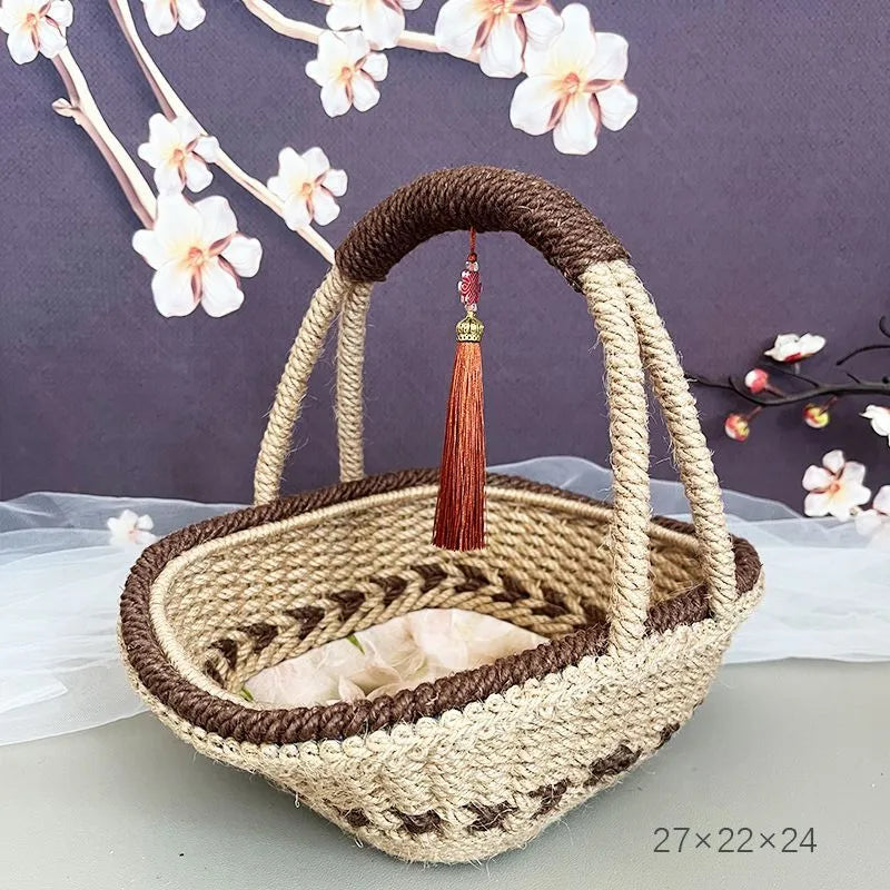 Coffee brown hand-woven straw basket with hemp rope detailing, 19cm long by 12cm wide