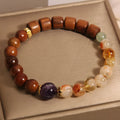 Yellow crystal amethyst bracelet with pearl and rhinestone decorative elements