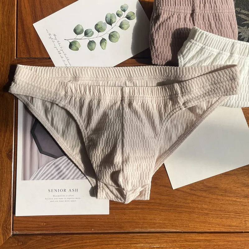 Men's solid colour pure cotton triangle briefs with a mid-waist body-shaping design.