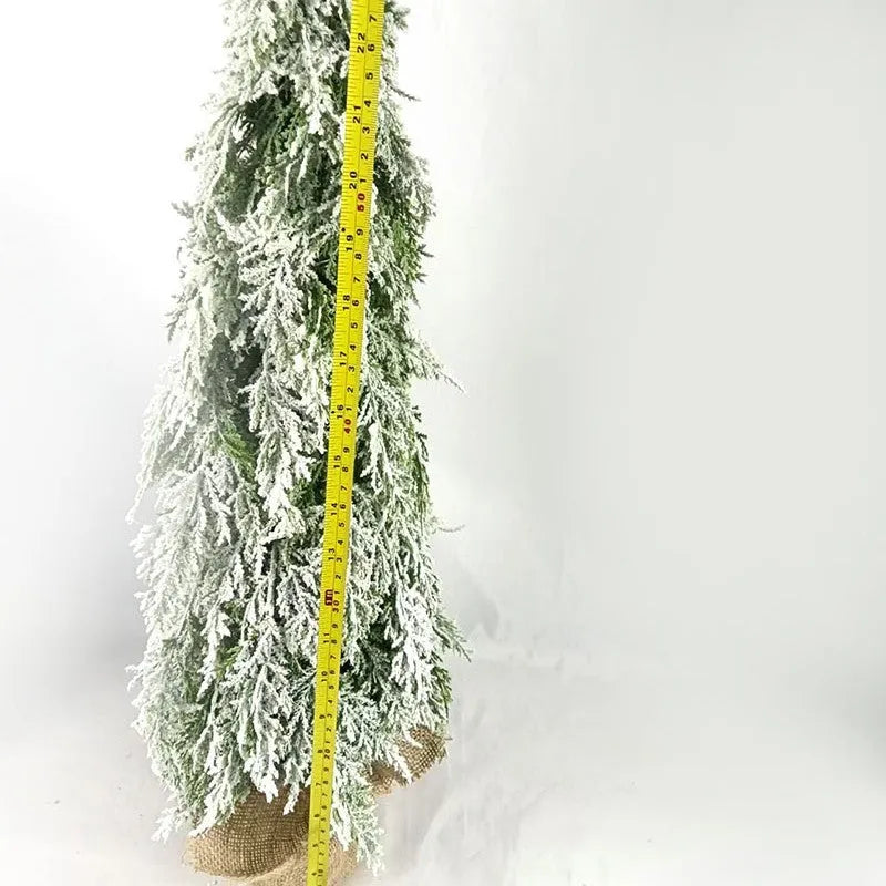 Small 24-inch artificial Christmas tree with battery-powered lights and PE simulated snow spray on branches