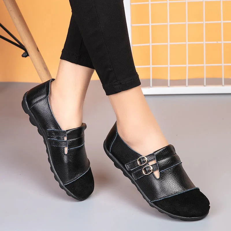 Women's casual flat shoes with Velcro fastening in black, showing round toe and beef tendon sole