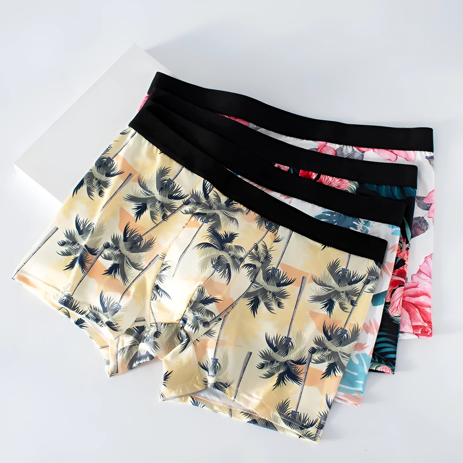 Men's ice silk underwear in polyester with floral print and mid-waist design