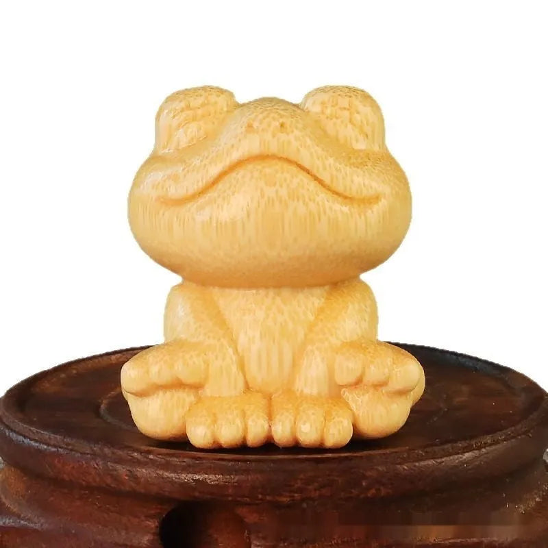 Smiling frog solid bamboo carving ornament measuring 5cm high with cartoon cute style