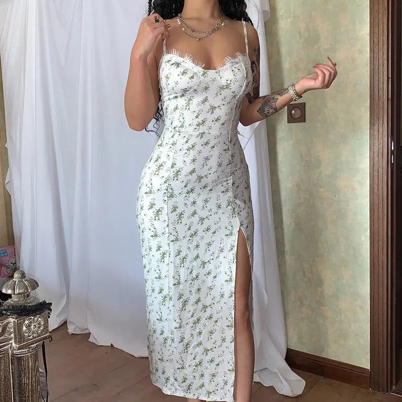 Women's blue lace flower print long dress with black suspender straps and a thigh-high side slit.