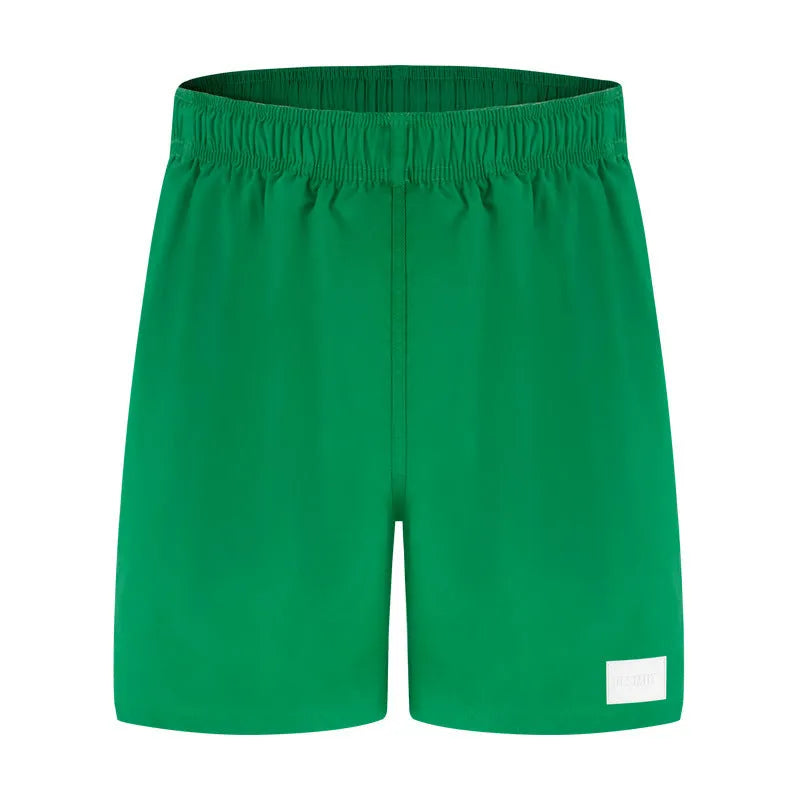 Men's solid colour quick-drying nylon sports shorts on a white background.