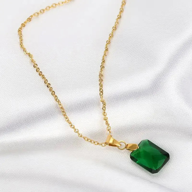 Rectangular green copper geometric pendant necklace on an O-ring chain.