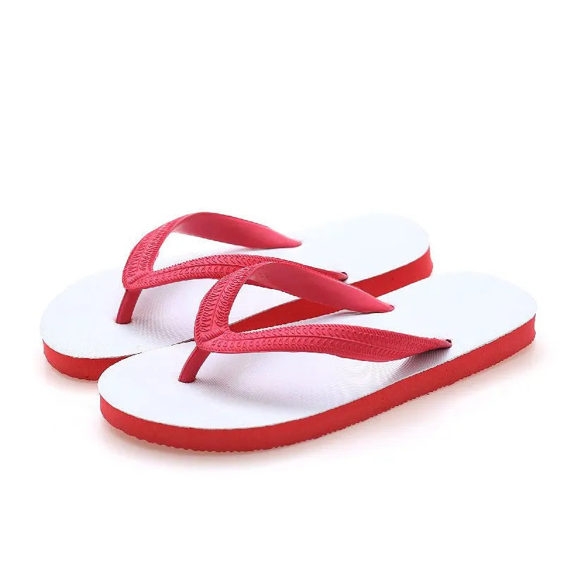 Men's rubber flip-flops in black with a fish logo, showing non-slip sole tread.