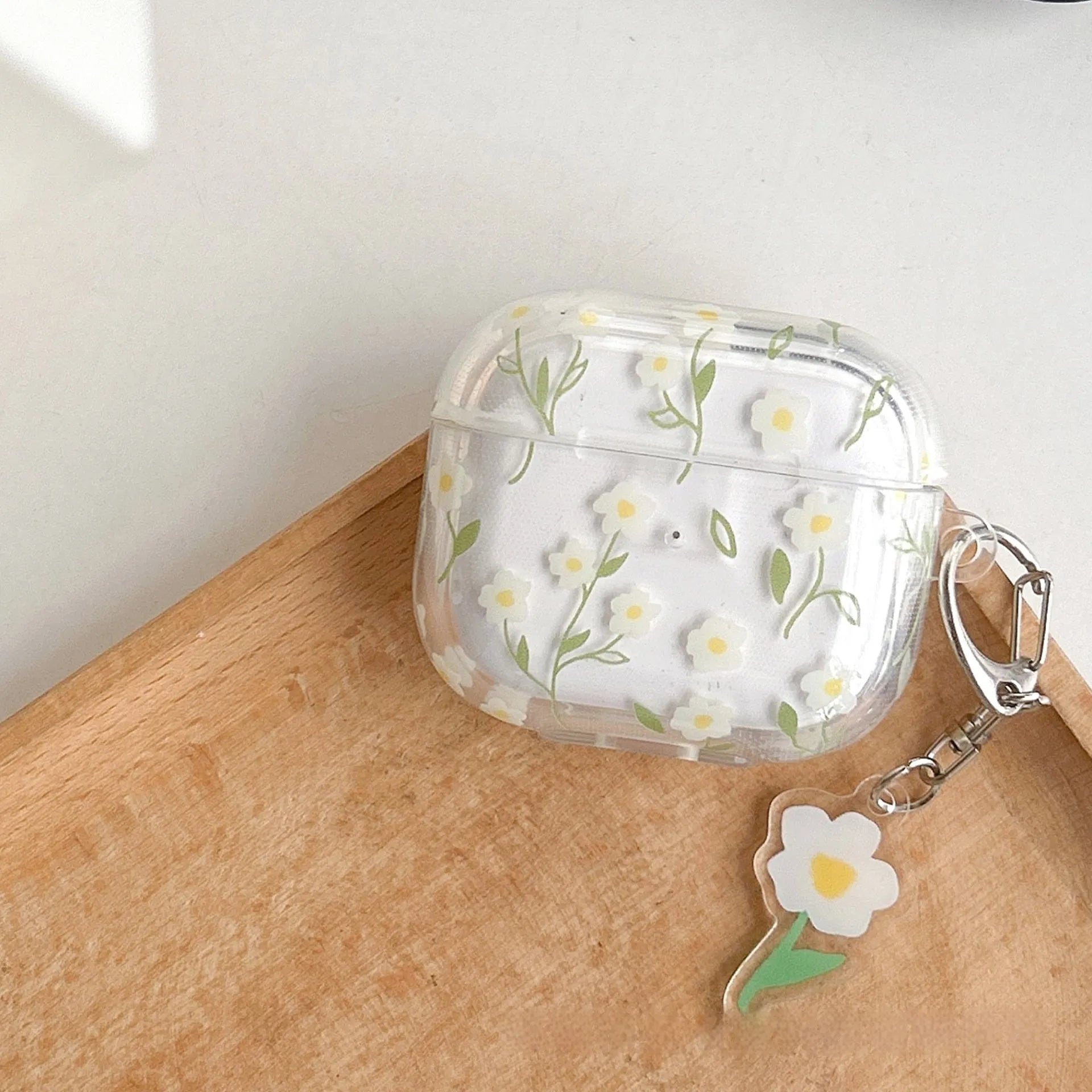 Clear TPU protective case with white floral pattern for Apple AirPods charging case