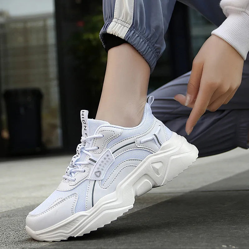 White women's casual mesh sports shoes with a buckle and round toe on a thick PU sole.