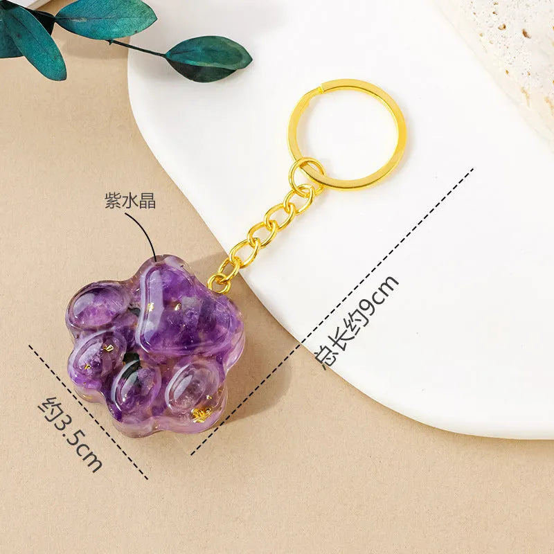 Natural crystal cat's paw keychain pendant in assorted gemstone colours on a keyring.