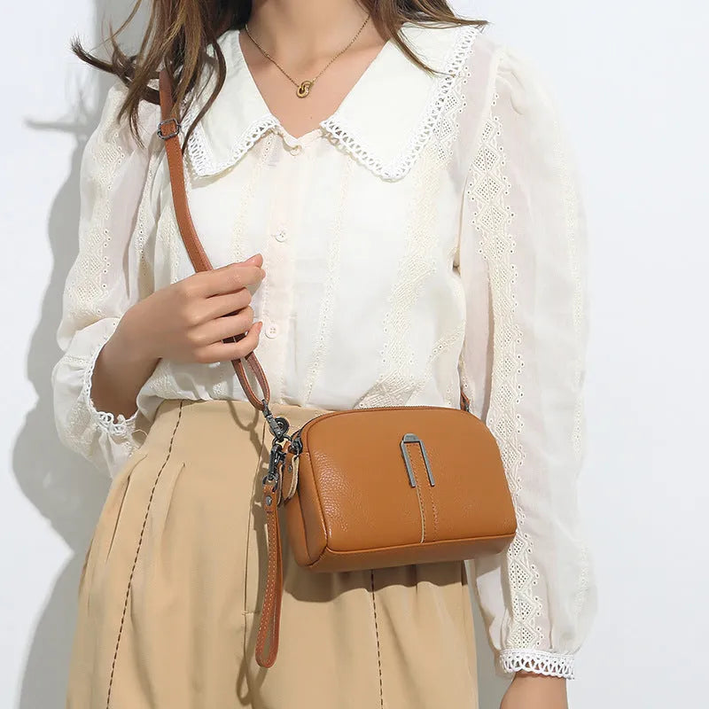 Genuine leather women's square shoulder bag in dark green, showing its horizontal 19x13x6cm shape.