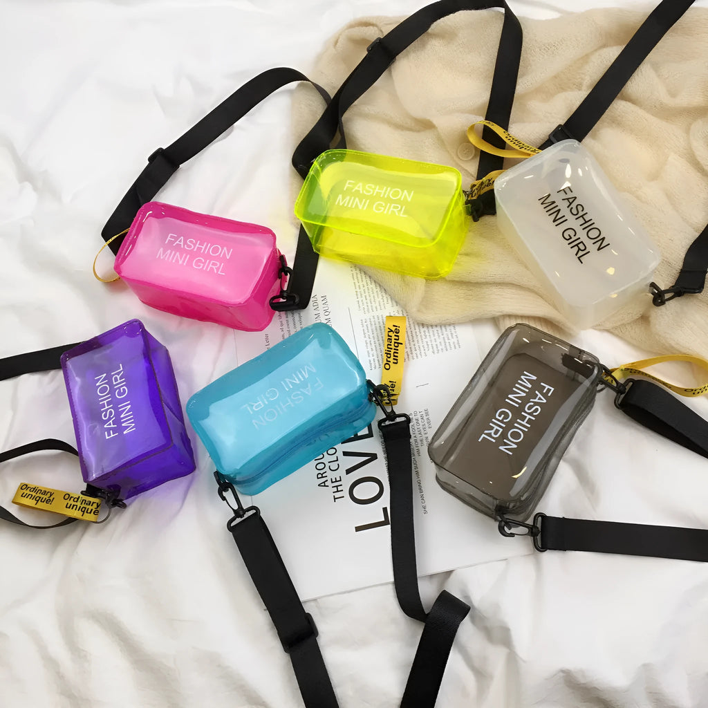 Transparent square women's shoulder bag in jelly material with a diagonal cross strap, showing internal mobile phone pocket.