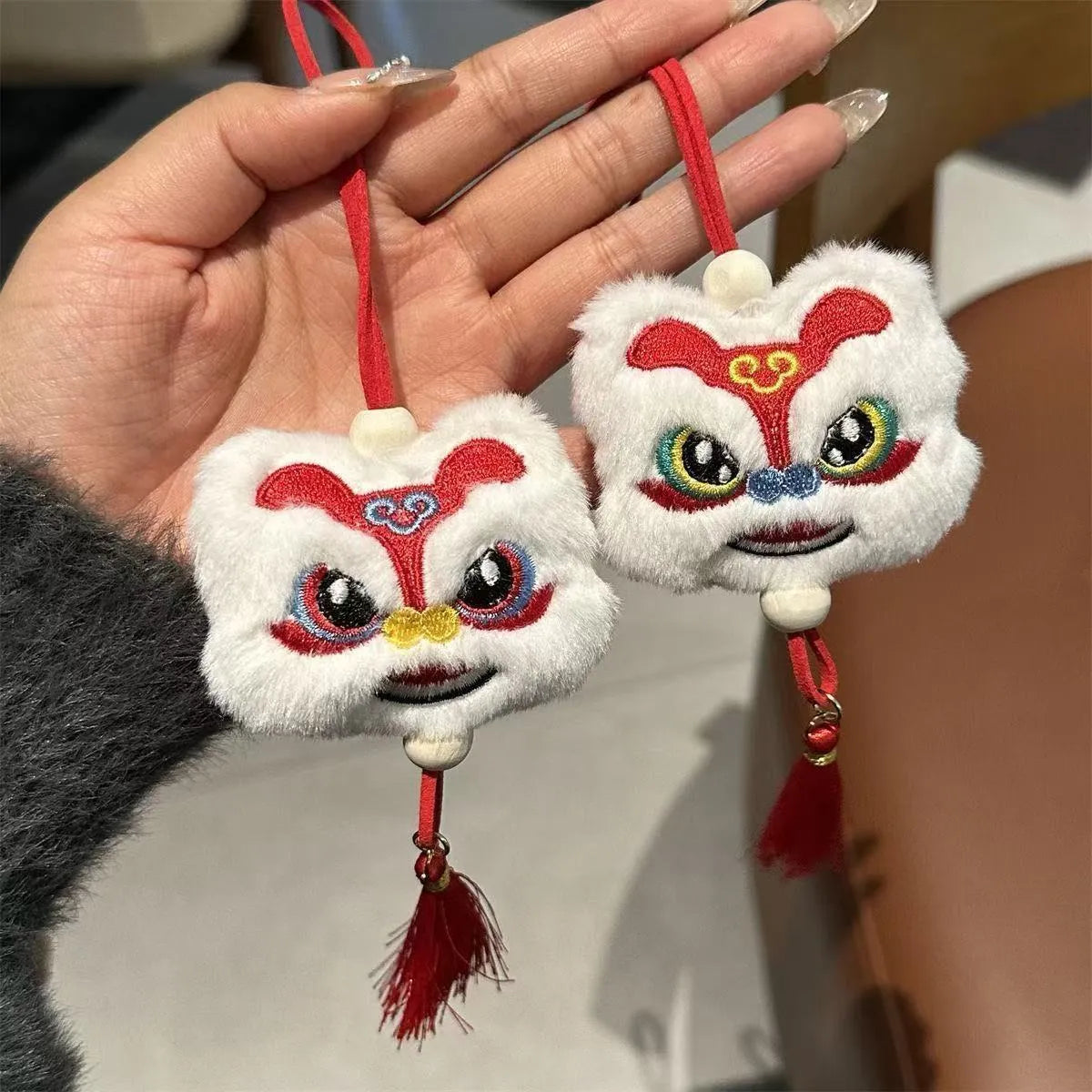 Chinese style blue plush lion keychain ornament with star stone detail and cartoon styling
