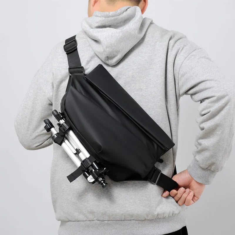 Men's grey medium crossbody sling bag showing internal phone and document compartments