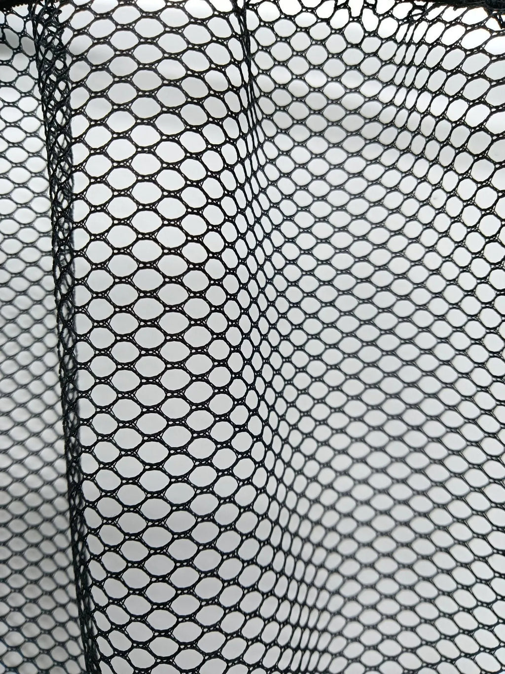 Car trunk elastic storage net organising loose items in vehicle boot