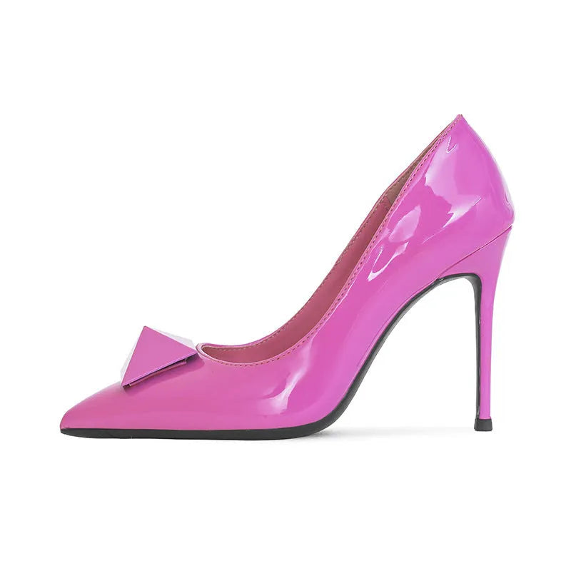Pink patent leather women's pointed toe stiletto high heels with a buckle.