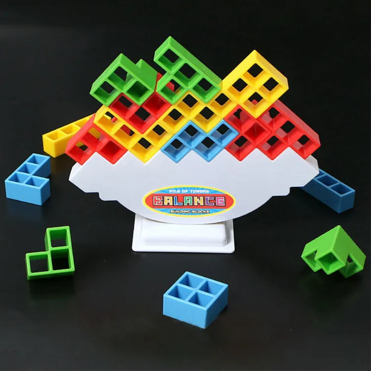 Colourful plastic balance stacking game with blocks, chassis, and base on a table
