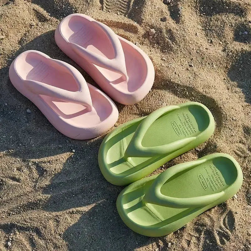 A pair of EVA thick-soled flip-flops with a bow detail on the upper, shown in one of the available colours.