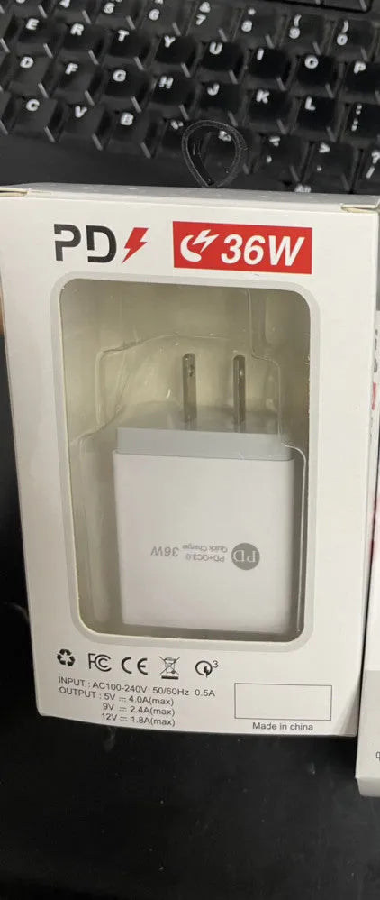 Black or white USB fast charging head with multiple ports, supporting QC3.0 and PD 20W charging.