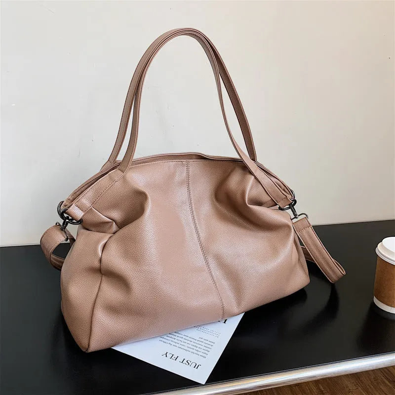 Large soft black PU messenger tote bag with car suture detailing and a long shoulder strap