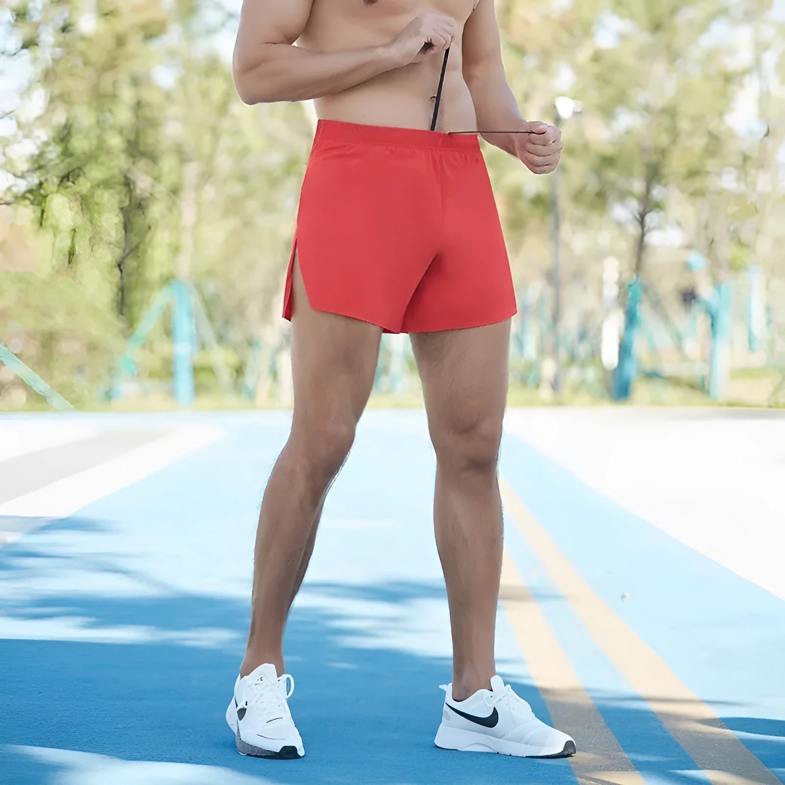 Men's loose fit off-road running shorts in grey, shown from front, with high waist and quick-dry fabric.