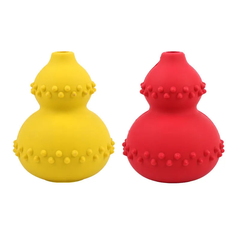 Natural rubber pet toy resistant to biting and grinding, treat dispensing ball in red, 11.3 by 8.5 cm