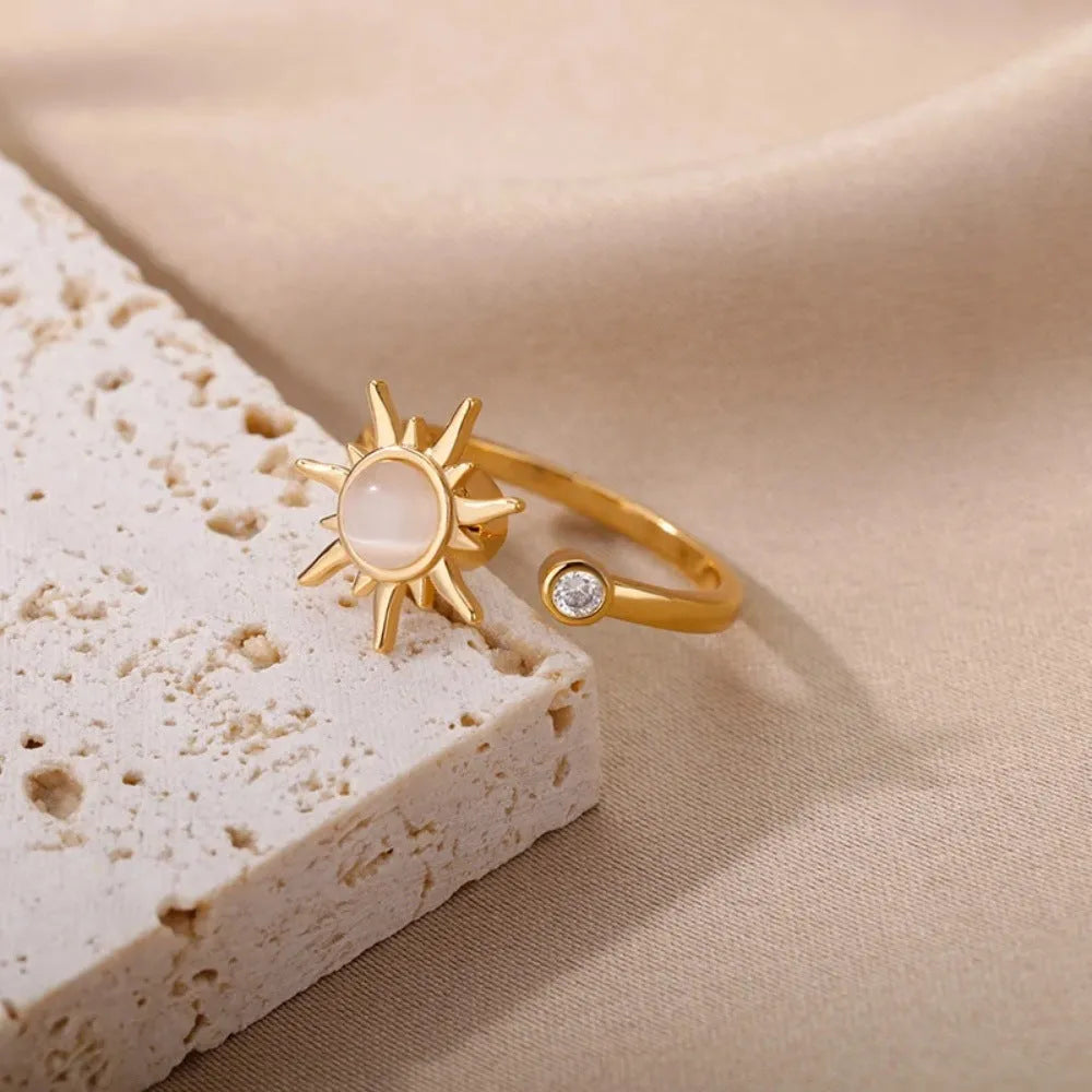 Adjustable copper decompression ring with rotating mechanism in gold electroplated finish