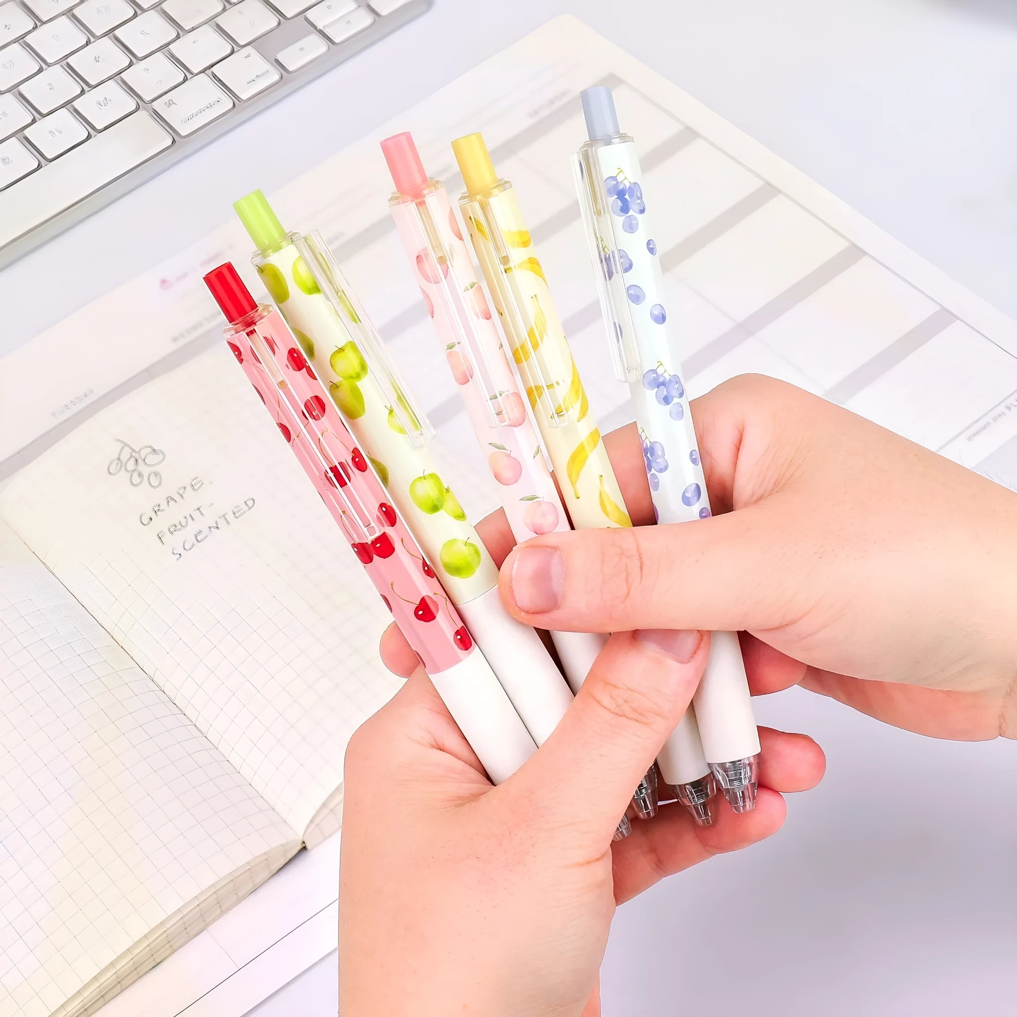 Three fruit-themed pressurised pens with 0.5mm quick-drying black ink