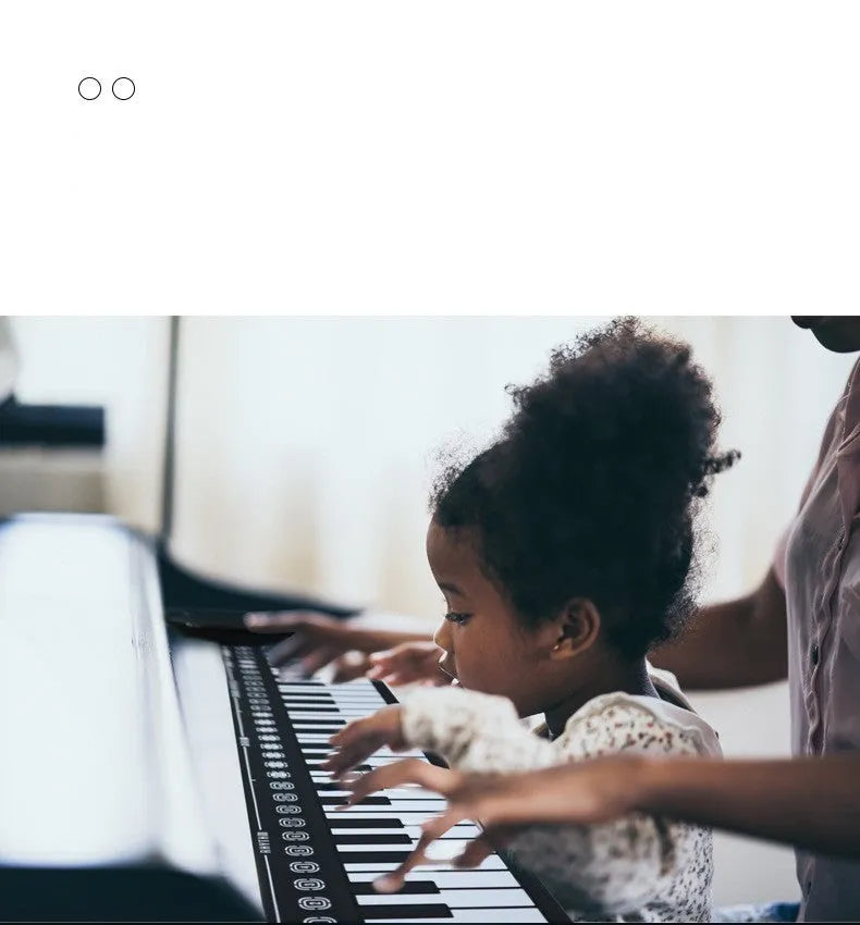Portable folding electronic keyboard with roll-up silicone keys and ABS control panel in black, silver, or white.