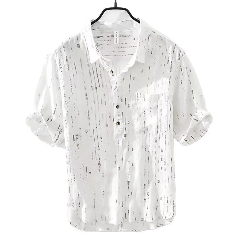 Man wearing a loose-fit black short-sleeved polo shirt, cardigan style, for casual summer wear.