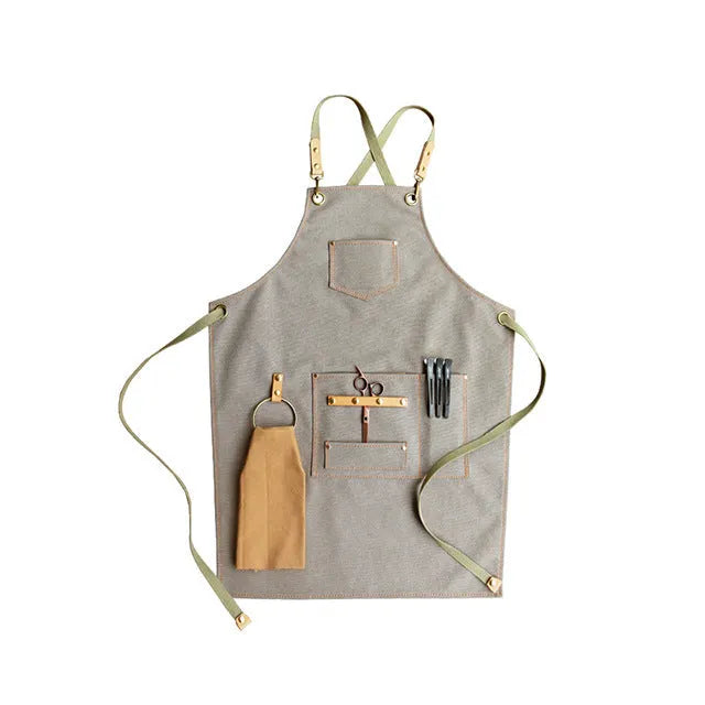 Canvas cross strap apron in camel colour shown from the front.