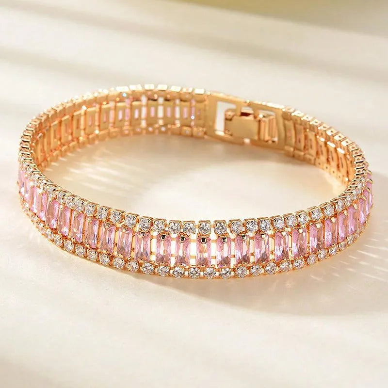 Unisex gold electroplated double-row diamond zirconia tennis chain bracelet on white background