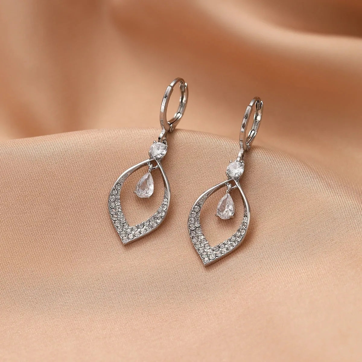 Women's gold and silver water drop tassel earrings with zircon detailing on thickened ear buckles