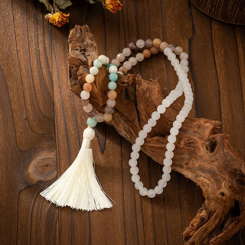 Vintage bohemian style natural stone bead necklace and bracelet set showing geometric round beads and tassel detailing