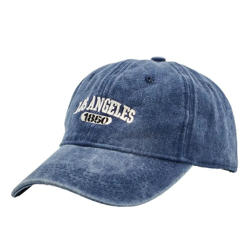 Retro personalised distressed embroidered peaked cap in beige colour with adjustable strap and conical crown.