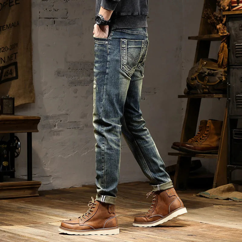 Men's skinny fit retro colour jeans with a zip fly, laid flat.