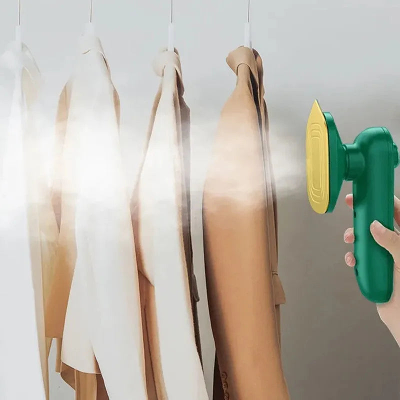 Dark green portable hanging steam iron with ceramic panel and power cord.
