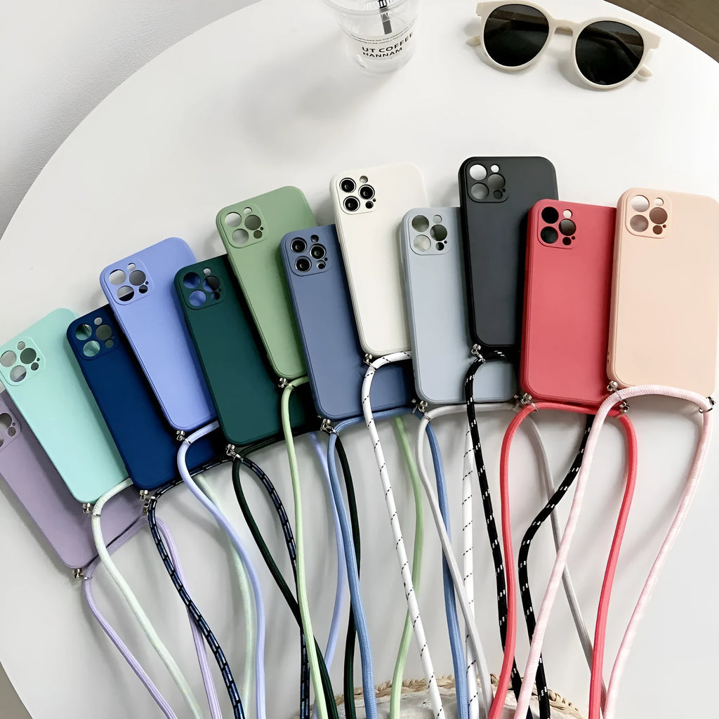 Liquid silicone phone case with crossbody lanyard for iPhone 13 Pro in black, showing rear cover and attached strap