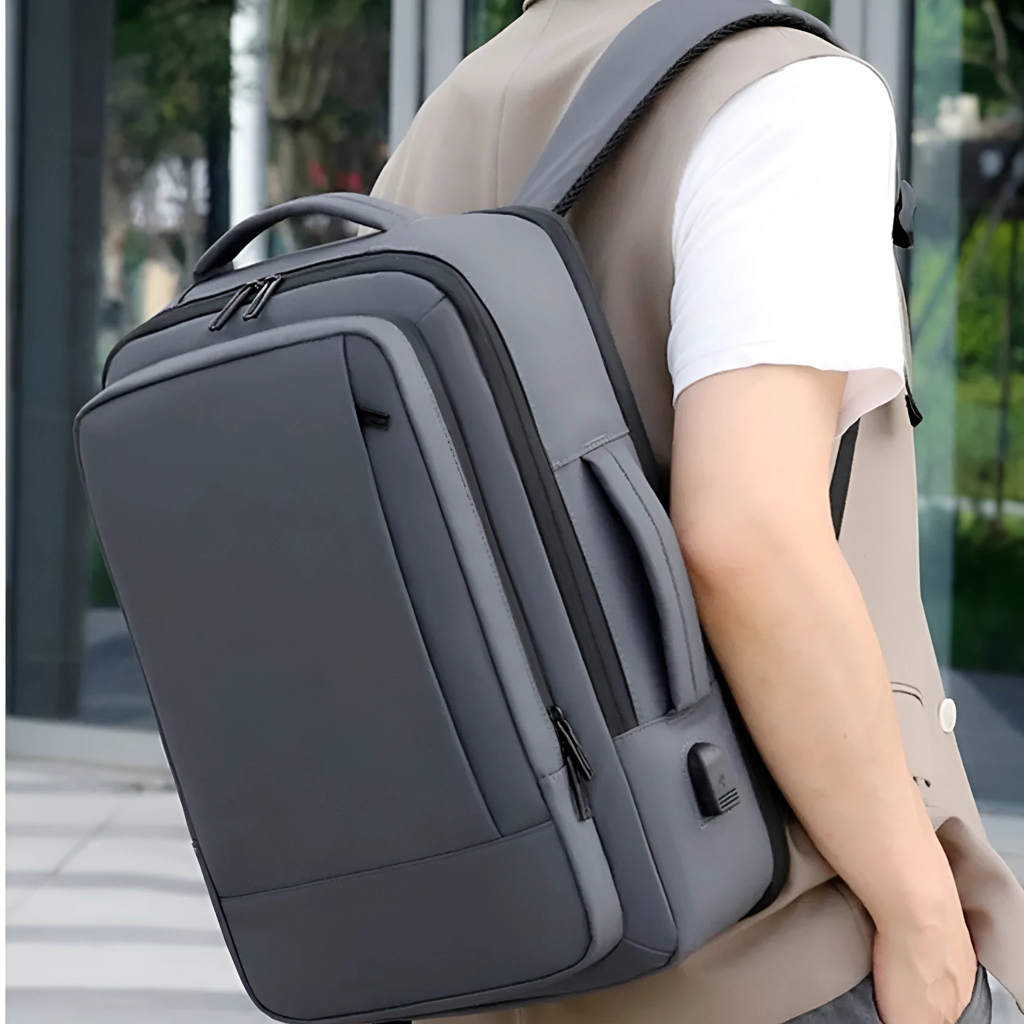Black waterproof Oxford cloth business backpack with curved shoulder straps and laptop compartment