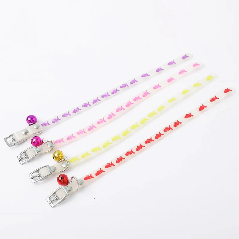 Adjustable cat luminous collar with silicone chain and metal bell showing nighttime illumination