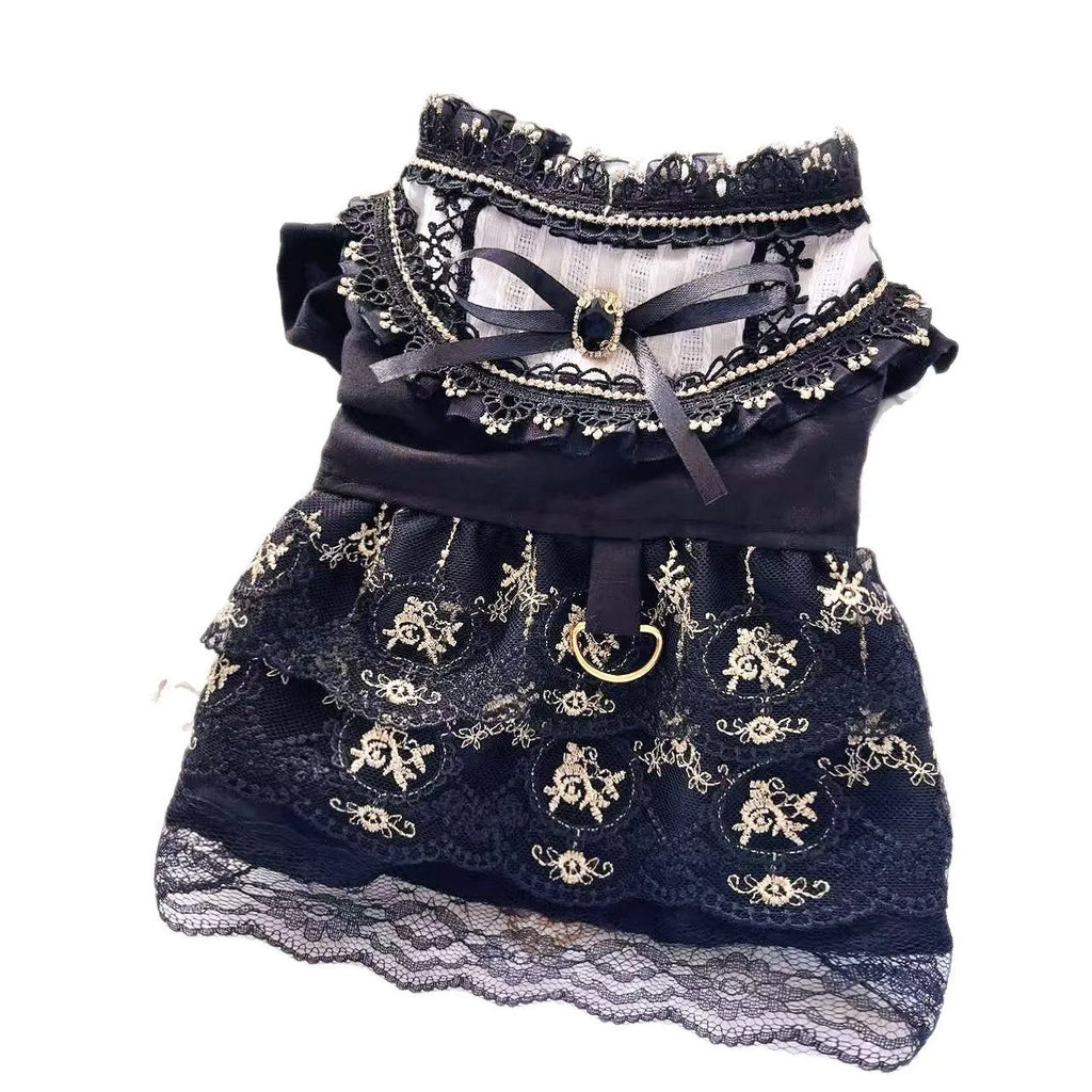 Golden Gothic princess skirt costume for a small dog on a mannequin, showing the tiered skirt design.